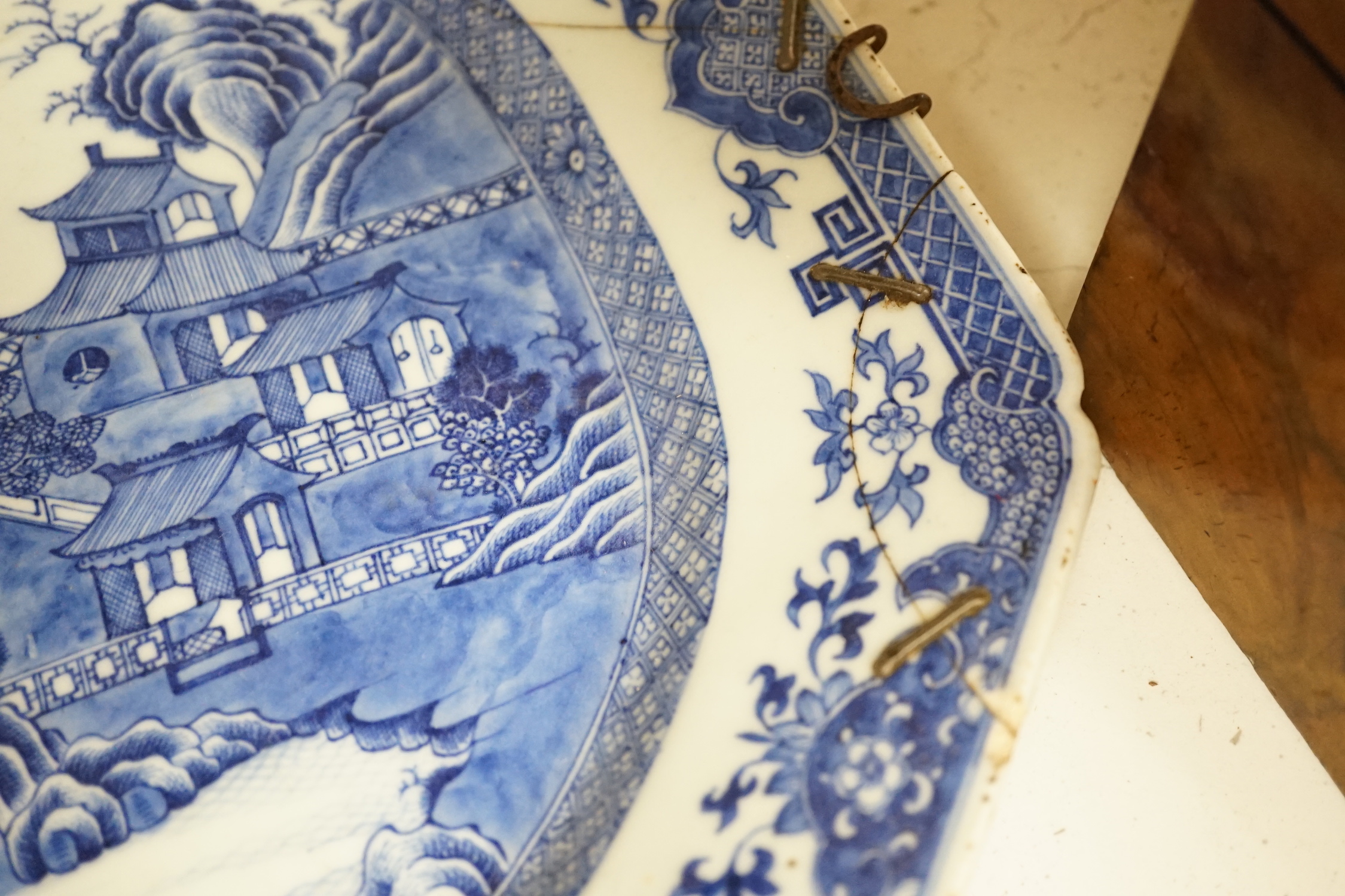 Three 18th century Chinese blue and white meat plates, largest, 41.5cm wide, 35cm deep (a.f.)